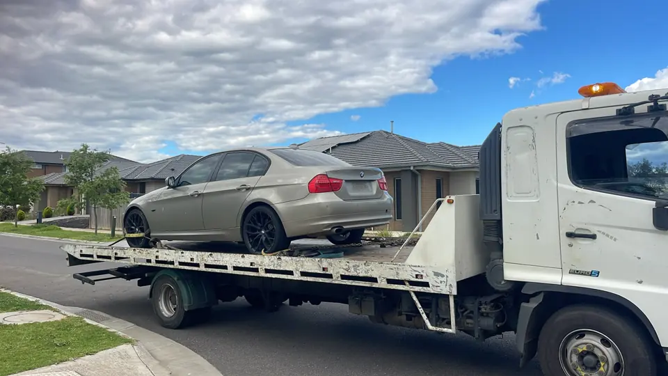 Vehicle carried on a flatbed truck