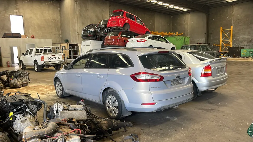 Silver car inside a workshop