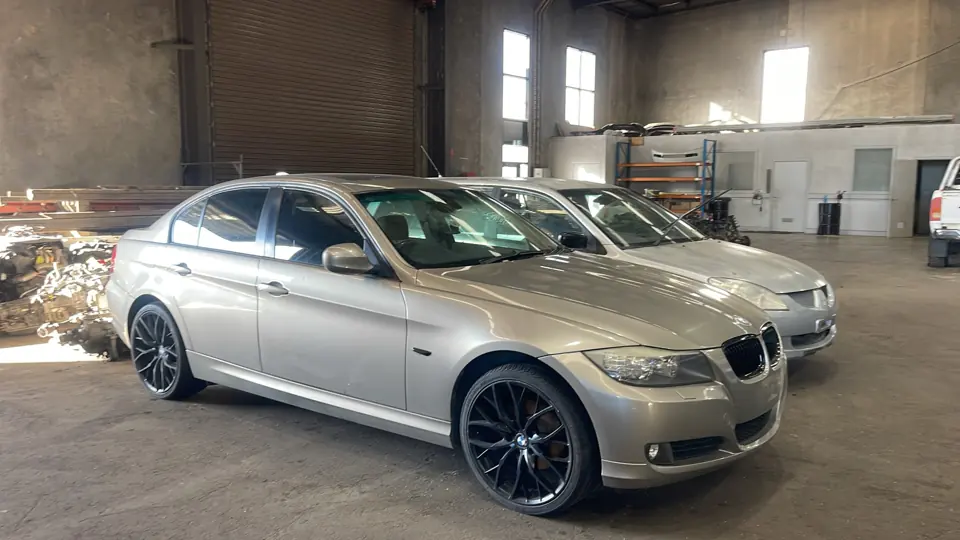 Silver sedan inside a workshop