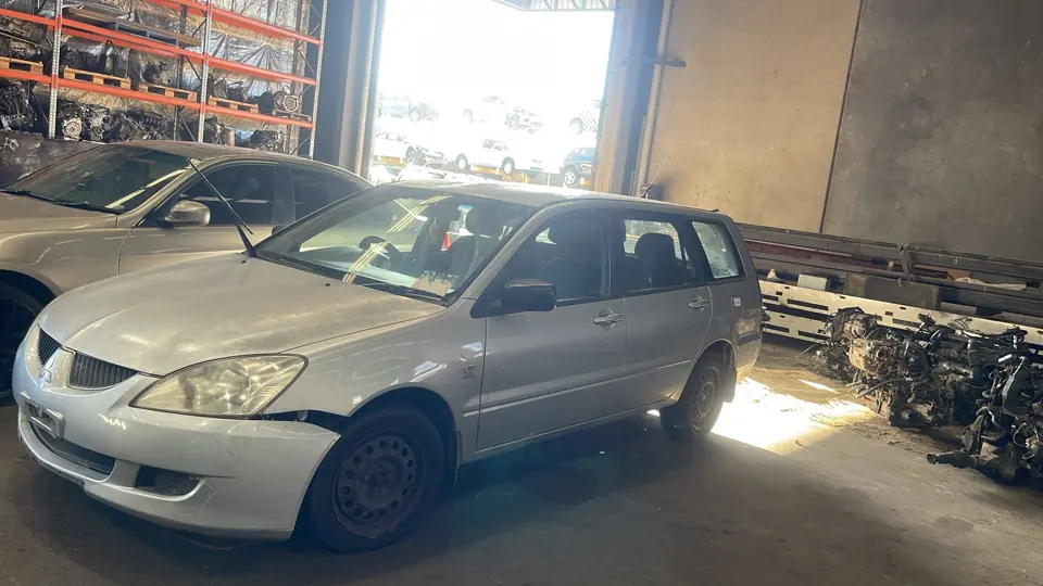 Silver sedan parked indoors