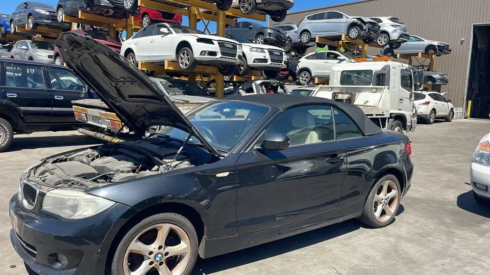 Dark sedan with its bonnet open