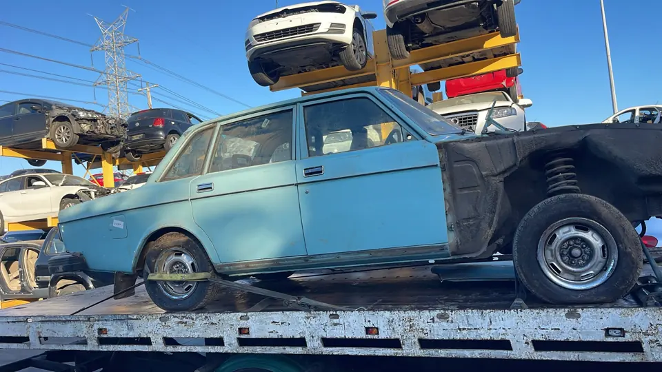 Older vehicle on a transporter