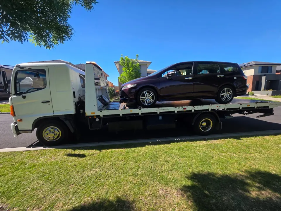 Dark vehicle on a flatbed