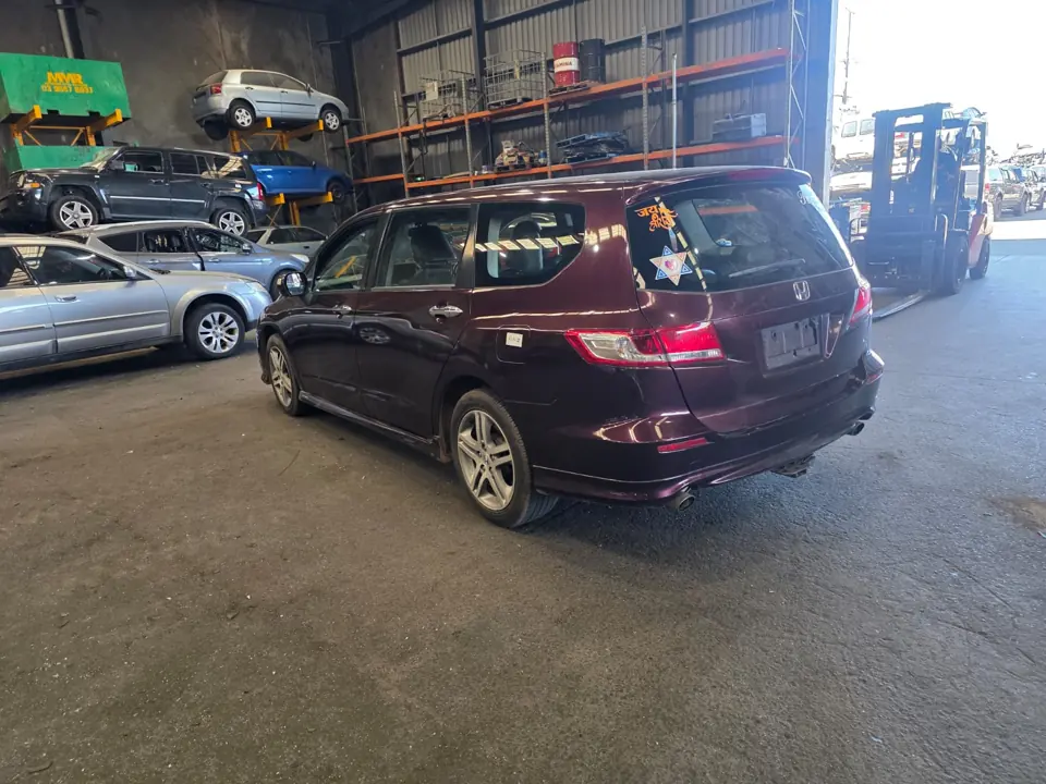 Dark SUV inside a workshop