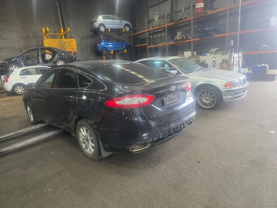 Dark car inside a workshop