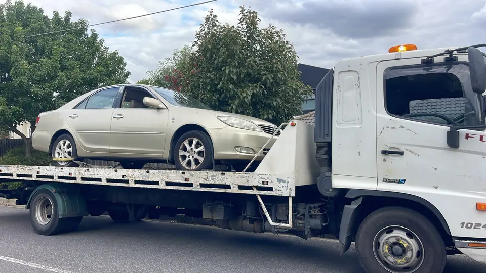 White car loaded for transport