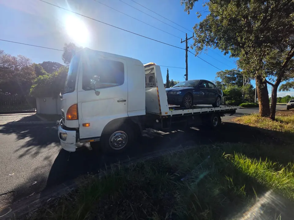 White recovery truck outdoors