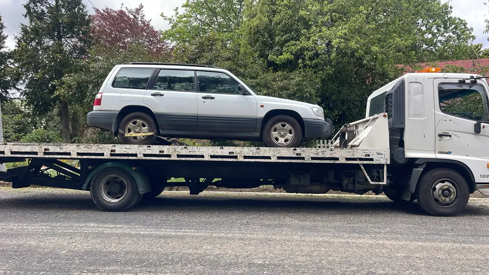 Silver vehicle on a flatbed